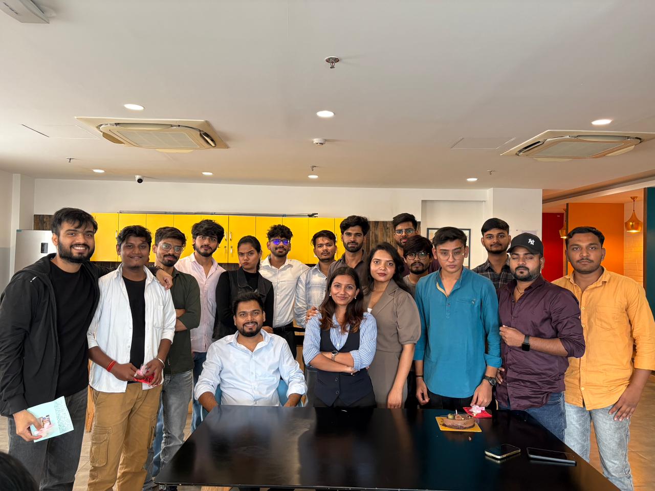 Webelio team celebrating together in the office